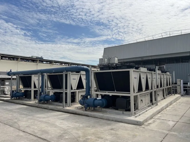 Haier air-cooled chillers with blue pipework on a rooftop