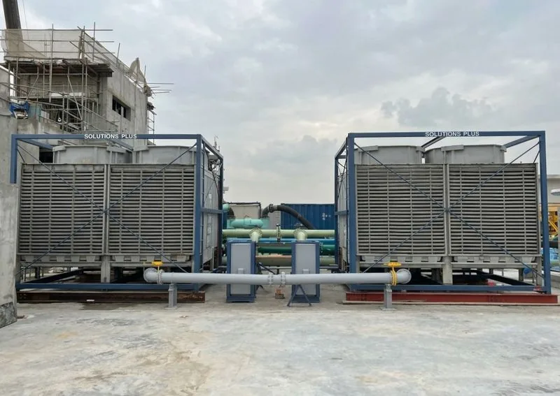 Two Solutions Plus cooling towers on a rooftop platform